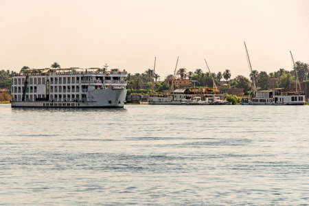 Luxor Egypt 18.05.2018 View on the Nile River with the Cruise Boat swimming Hotel on West Bank and near Luxorのeditorial素材