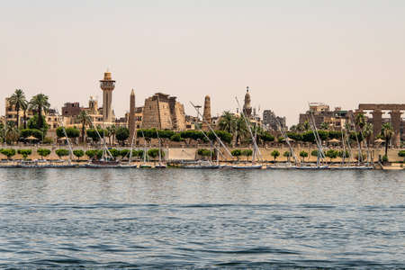 Luxor, Egypt 17.05.2018 View of the Nile river west bank town coastline with sailboats in Luxor, Egyptのeditorial素材