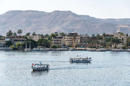 Luxor, Egypt 17.05.2018 View of the Nile river west bank town coastline with sailboats in Luxor, Egyptのeditorial素材