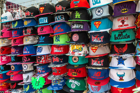 Mayen, Germany - 14.10.2018 Baseball team and comic cap store with different colorful logo caps for saleのeditorial素材