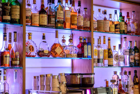 Grenzau Germany 27.07.2019 - Bitters and liquor bar counter with different bottles vintage style ambient lightのeditorial素材