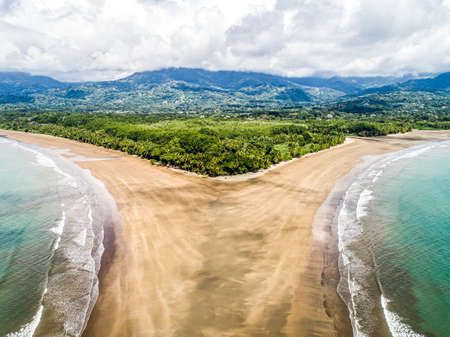 Aerial view National Park Punta Uvita Beautiful beach tropical forest pacific coast Costa Rica shape whale tailの写真素材