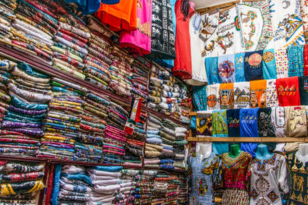 EDFU, EGYPT 19.05.2018 Traditional egyptian colorful palatine and clothes sold at open air market in Edfu Horus Templeのeditorial素材