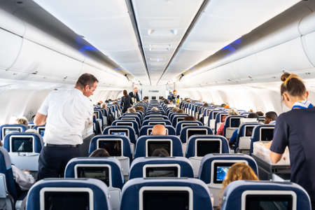 Frankfurt Germany 18.11.19 Condor Air airplane logo passengers and Board Crew inside a Boeing Airplaneのeditorial素材