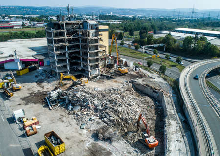 Aerial view of Building House Demolition and construction site Excavator with hydraulic crasher machineの写真素材