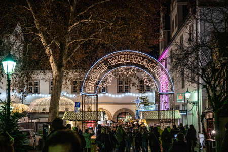 Koblenz Germany 15.12.2019 entrance to Christmas market at night saying frohe Weihnachten german for Merry Christmasのeditorial素材