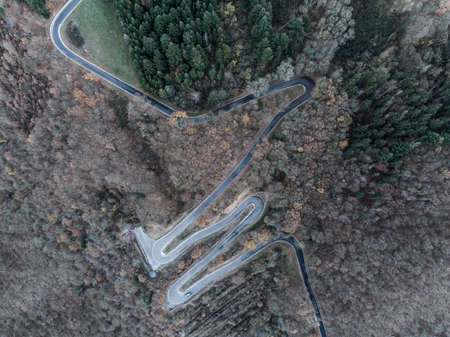 Seasons Concept winter or fall Aerial view Winding road serpentine mountain pass village Brodenbach...