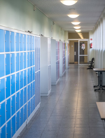 15.02.2021 Koblenz Germany Empty hallway with colored lockers and door room at school or university in germanyのeditorial素材