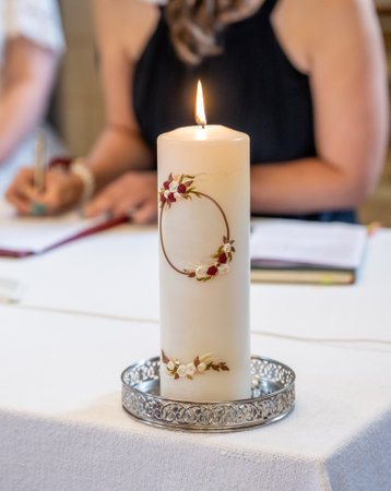 The wedding candle for the bride and groom. candle is the family hearth symbol at a weddingの写真素材