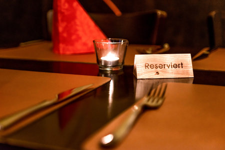 German Reserved sign label on the table of restaurant in an Germany cityの写真素材
