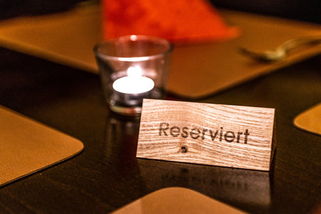 German Reserved sign label on the table of restaurant in an Germany cityの写真素材