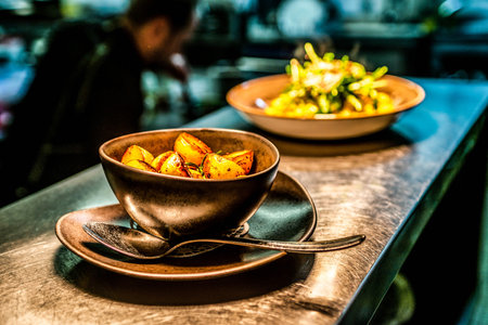 delicious Roasted mini small potato in plate with rosemary spicedの写真素材