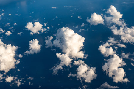 Aerial cloudscaspe picturesque clouds and sky from top view over the horizon
