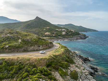 Aerial view car Roadtrip Winding road along rocky coast of Cap Corse peninsula on Corsica island Franceの写真素材