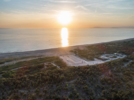 Camper rv caravan on mediterranean coast in Italy. Wild camping on sea shore. Holidays and travel in motor homeの写真素材