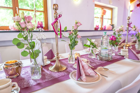 Wedding decor. Close up of a wedding table decoration with white and pink flowers and candles Wedding floristic conceptの写真素材