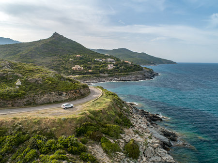 Aerial view car Roadtrip Winding road along rocky coast of Cap Corse peninsula on Corsica island Franceの写真素材