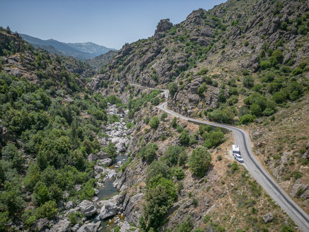 Camping Caravan driving through Canyon de la Ruda road Corsica down the pass monte Cinoの写真素材