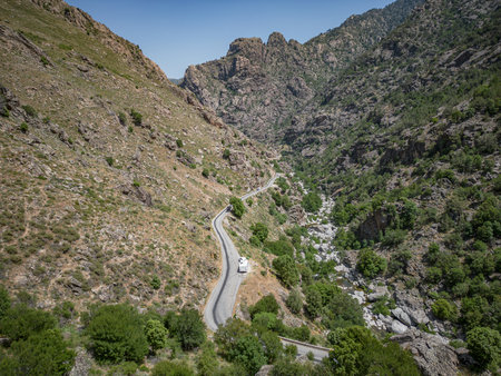 Camping Caravan driving through Canyon de la Ruda road Corsica down the pass monte Cinoの写真素材