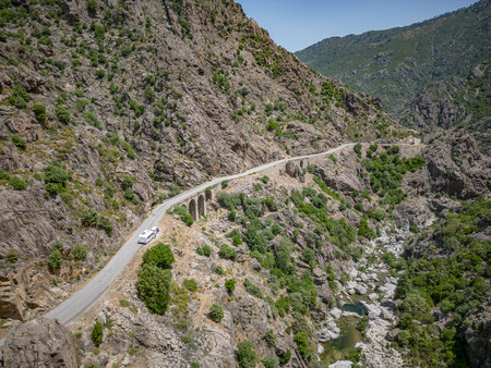 Camping Caravan driving through Canyon de la Ruda road Corsica down the pass monte Cinoの写真素材