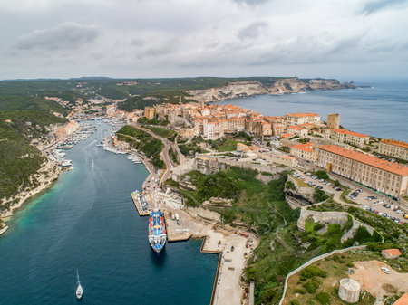 Aerial view marina cape Bonifacio south Corsica France citadel on rocky promontory on wild white limestone cliffsの写真素材