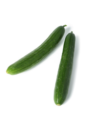 Cucumbers isolated on a white background with shadowの写真素材