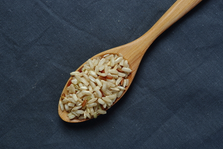 Pile of brown rice on Naperyの写真素材