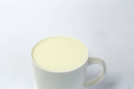 Fresh glass of milk isolated over white backgroundの写真素材