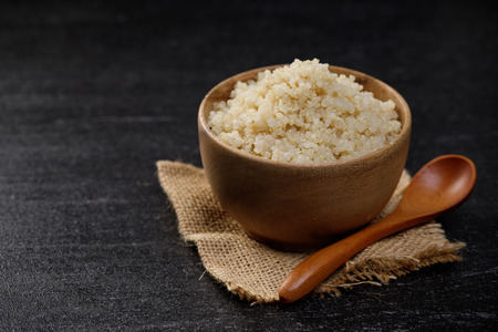 Healthy quinoa in the wooden bowl, Healthy food habits and concept of balanced dietの写真素材