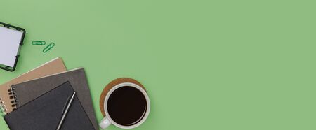 Top view workspace office supplies mockup with hot coffee cup, books and accessories isolated on...