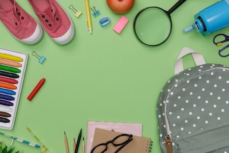 Top view mockup of Education's accessories with backpack, student books, shoes, colorful crayon, eye...