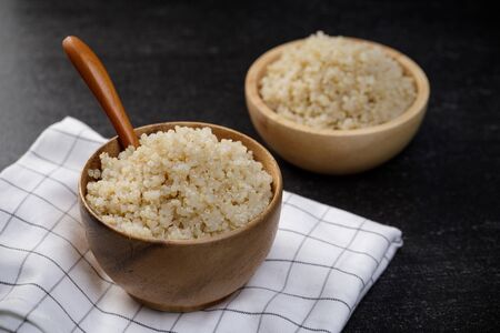 Healthy quinoa in the wooden bowl, Healthy food habits and concept of balanced dietの写真素材