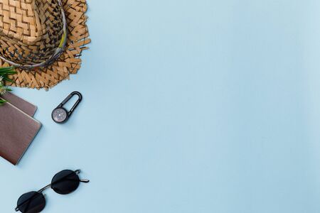 Top view mockup of Traveler's accessories with passport, compass, wallet, camera, hat and airplane...