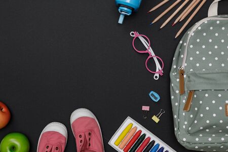 Top view mockup of Education's accessories with backpack, student books, shoes, colorful crayon, eye...