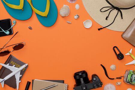 Traveler's accessories with passport, slippers, books of travel plan, wallet, camera, hat, backpack...