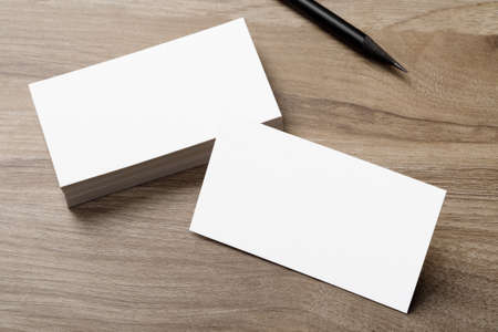 Minimal business card mockup on wooden deskの写真素材