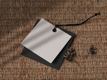 Label Tag with dry flower on bamboo matの写真素材