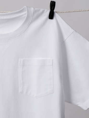 Pocket T-Shirt handing on drying railの写真素材