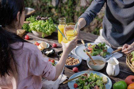 Table with a variety of vegetables in a plate, set for a delicious and healthy meal in a restaurant with salad, dinner, and buffet options, perfect for a wedding banquet or party celebrationの写真素材