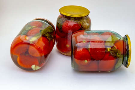 Home canning jars with blanks for the winter on a white background.の写真素材