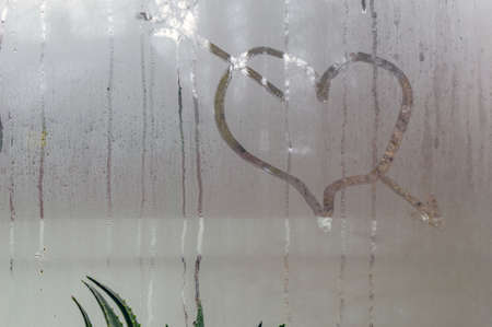 On fogged acne, a heart pierced by an arrow is drawn.