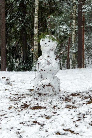 Snowman molded from the first snow in the park.の写真素材