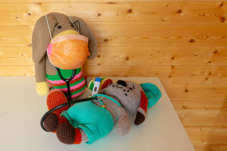 Amigurumi dolls treat each other from coronavirus.の写真素材