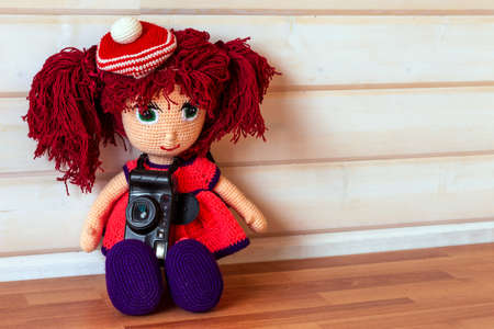 Handmade doll Amigurumi girl sitting.の写真素材