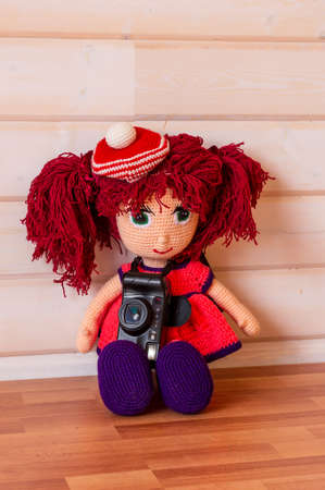 Handmade doll Amigurumi girl sitting.の写真素材