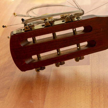 New strings for a six-string guitar are prepared.