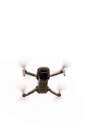 Quadrocopter small in flight close up isolate