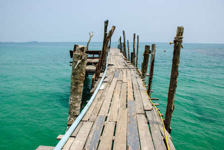 old wooden jetty leading out onto the seaの写真素材