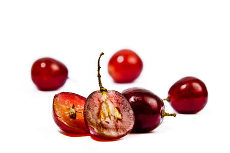 Red grapes on a white backgroundの写真素材
