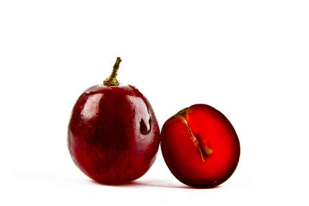 Red grapes on a white backgroundの写真素材